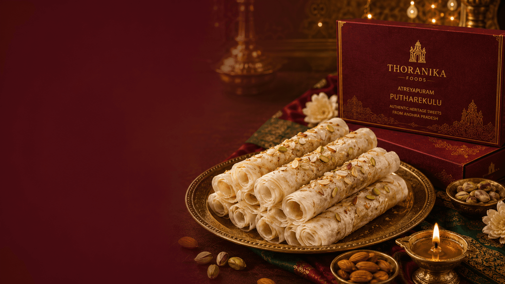 Thoranika Putharekulu gift box beside a brass plate of paper sweets